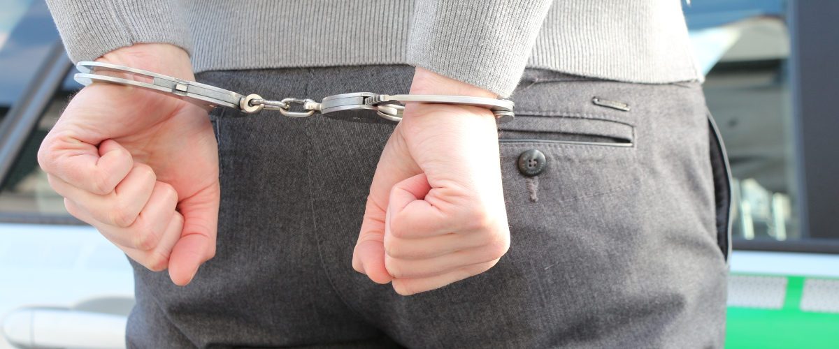man in handcuffs, criminal law